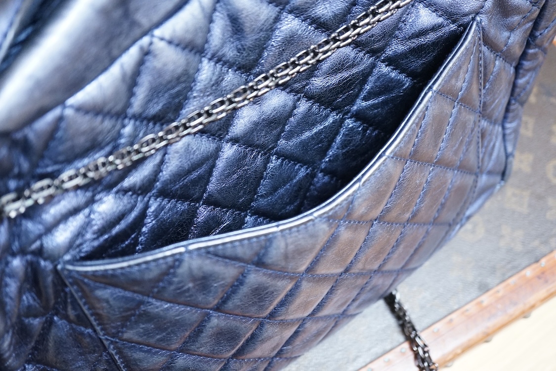 A Chanel metallic 2.55 re-issue quilted camera bag, date code 12407681, 35cm wide